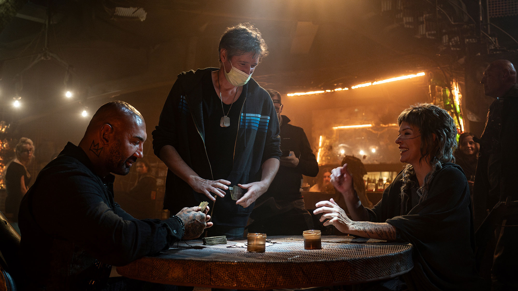 Dave Bautista, Paul W.S. Anderson, and Milla Jovovich on the set of In the Lost Lands
